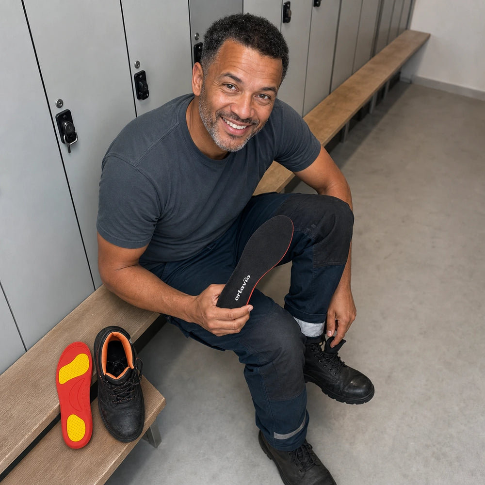 worker fitting Ortavio ArcCore insoles in a locker room