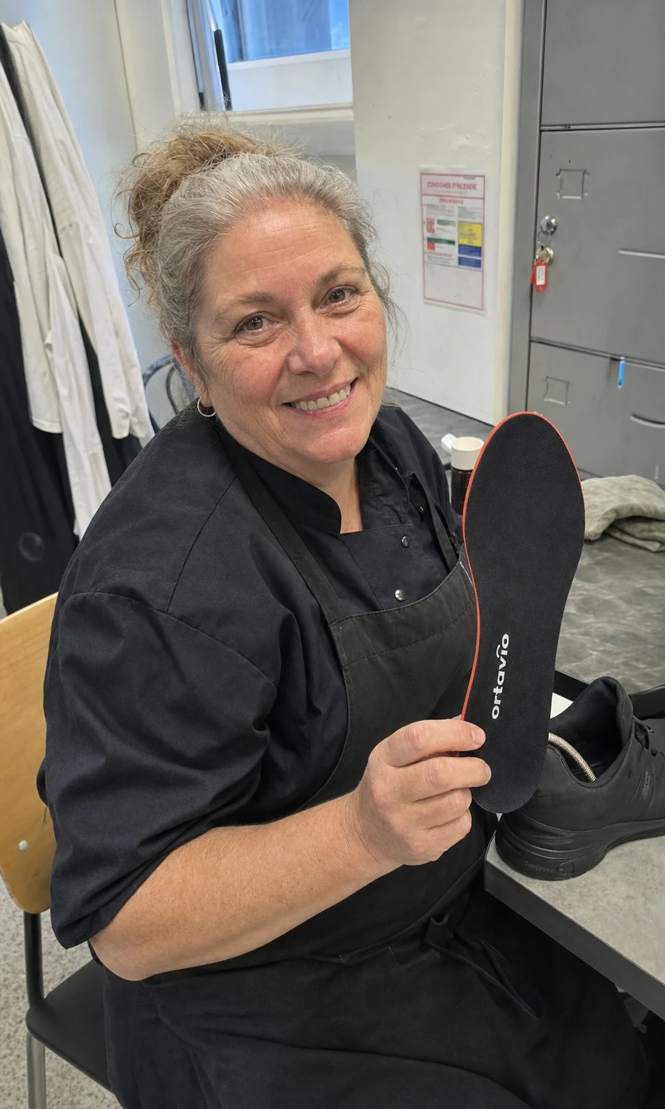 kitchen worker holding an Ortavio ArcCore insole