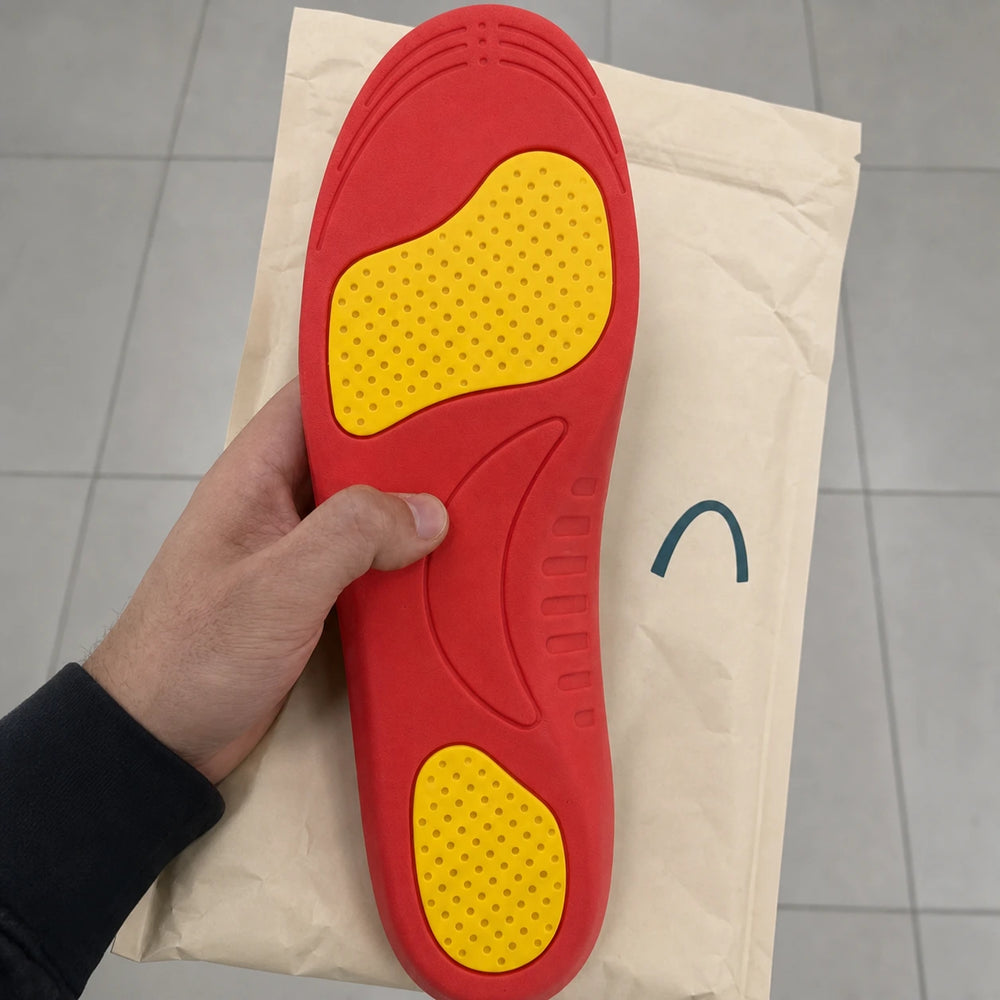 Ortavio ArcCore insole unboxing with coral and yellow underside visible